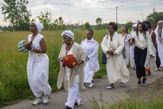 Detroit, Michigan - African-Americans gather on the banks of the Detroit River to commemorate