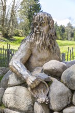 Figure of the river god Danuvius by sculptor Wolfgang Eckert at the source of the Breg, source of