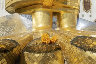 Feet of a 32 metre high standing Buddha decorated with glass mosaics and 24-carat gold, Luang Pho