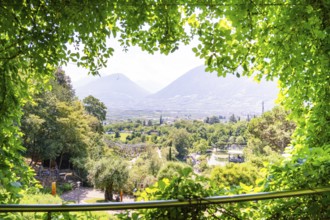 A panoramic view over a valley with trees and mountains in the background, Botanical Gardens, The