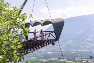Two people on a platform above the valley with a view of the mountain landscape, Botanical Gardens,