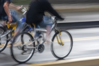 People riding bicycles, Photo with motion blur, City of Quito, Pichincha province, Ecuador, South