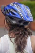 Woman wearing a helmet while cycling, Photo with motion blur, City of Quito, Pichincha province,