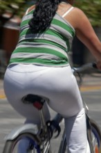 Woman riding a bicycle, Obesity, Photo with motion blur, City of Quito, Pichincha province,