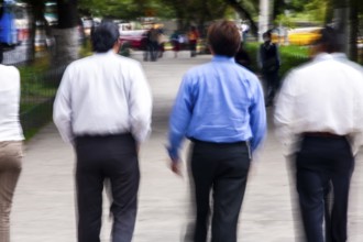 Men walking in street, Photo with motion blur, City of Quito, Pichincha province, Ecuador, South