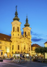 Baroque Mariahilferkirche church by night, Graz, Austria