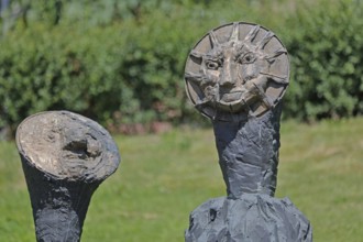 Sculpture Sun and Moon by Markus Lüpertz 2017, modern art, bronze sculpture, two faces, moon face,