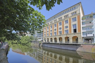 Melanchthonhaus with arcade built in 1914, reflection, Enz, river bank, Pforzheim, Northern Black