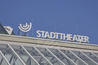 Roof with white inscription city theatre, modern building, emblem, cut-out, detail,
