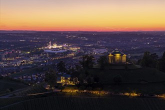 Chapel on the hill with city lights in the background, at sunset, grave chapel, spring festival,