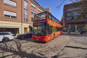 The Münsterbus, bus for city tours, tourism, general architecture, cobblestone street, blue