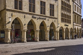 Old town, historic buildings, arcades, facade, window, lamp, wall anchor, cobblestone street,