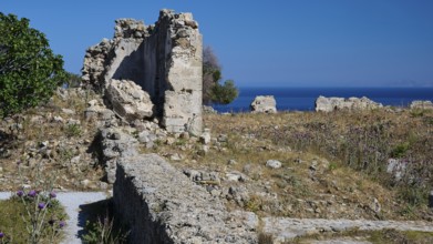 Stone ruins overlooking the sea and surrounded by greenery, Antimacheia, Medieval Fortress, St