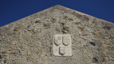 Coat of arms of the Grand Master del Carretto, Relief with coat of arms on the façade of an old