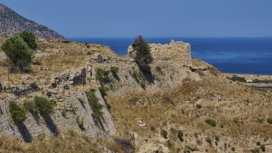 Weathered ruins on a dry coastal hill overlooking the sea, Antimacheia, Medieval fortress, St