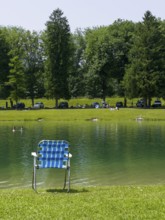 Camping chair by a lake