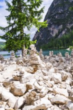 Cairn in front of a mountain lake, relaxing scene in nature, Pragser Wildsee, South Tyrol,