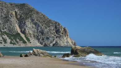 Beach, Kavo Paradiso, Paradise Beach, beach with rocky coast and clear blue sky by the sea,