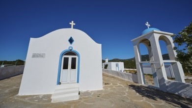 Chapel of Agios Charalambos, Traditional white chapel with bell tower and clear blue sky, Kefalos,