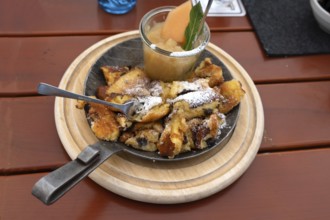 Kaiserschmarrn with apple sauce served in a small pan, Franconia, Bavaria, Germany