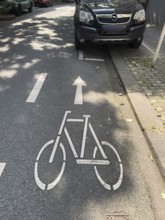 A cycle path on which a car park is marked for cars, Wuppertal, Germany