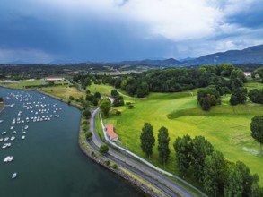 Sunset and storm clouds over Pyrenees and Saint-Jean-de-Luz from a drone, Nouvelle-Aquitaine,