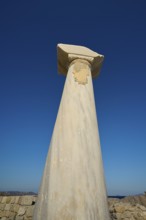 Close-up of an ancient column in front of a deep blue sky, Agios Stefanos Beach, Agios Stefanos