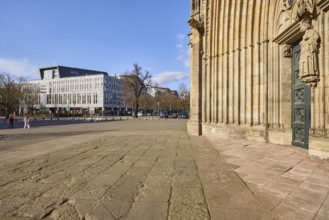 Magdeburg Cathedral, entrance, modern architecture, bare winter trees, pavement made of sandstone