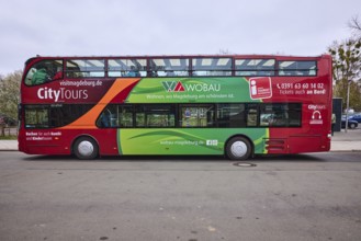 Tourist information, CityTours, tourism, bus for city tours, old town, diffuse light, milky blue