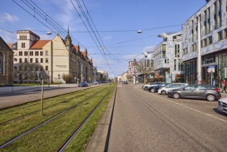Street, parking boxes, tram tracks, overhead lines, general architecture, vehicles, blue sky,