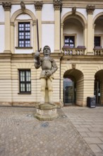 Roland figure, sculptor Martina Seffers, sandstone building, façade, window, door, town hall, old