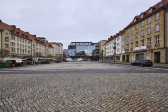 Old town, sandstone building, modern architecture, glass facade, cobblestone square, weekly market