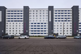 High-rise building, residential building, residential silo, façade with windows, car park with