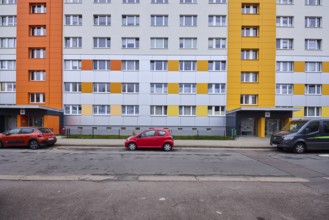 High-rise buildings, residential building, façade, window, car park with vehicles, diffuse light,