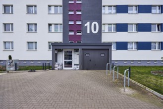 High-rise building, residential building, façade, entrance area, window, door, house number,