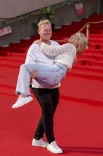 Jens Knossi Knossalla with girlfriend Lia Mitrou (influencer) at the German premiere of the