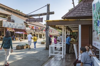 Visitors line up to purchase admission tickets to various parts of the Doi Tung tourist attraction