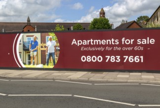 Apartments for sale for over 60s advertising hoarding, Churchill Retirement Living, Salisbury,