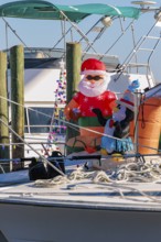 Inflatable Christmas decorations on the deck of a boat at the Biloxi Small Craft Harbor in Biloxi,