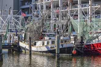 Commercial fishing boats at dock in the commercial section of the Biloxi Small Craft Harbor in