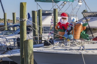 Inflatable Christmas decorations on the deck of a boat at the Biloxi Small Craft Harbor in Biloxi,