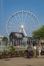The Wheel ferris wheel behind the Ole Smoky Moonshine store at The Island recreation center in