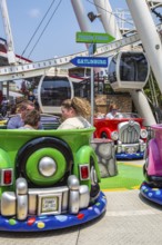 Tourists riding the Funny Cars ride at The Island recreation center in Pigeon Forge, Tennessee