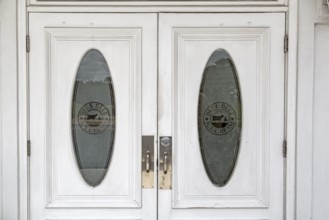 Etched glass entry doors to the Blue Bell Creameries Country Store and Ice Cream Parlor in