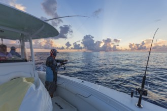 Offshore fishing in the Gulf of Mexico at sunset