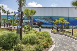 Sign directs guests to different attractions at Ocean Adventures Marine Park in Gulfport,