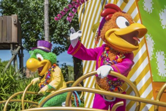 Disney character riding on float during parade through the Frontierland area of Magic Kingdom at