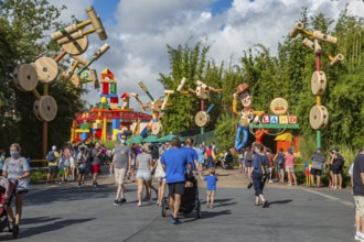 Masked park guests in Toy Story Land in Disney's Hollywood Studios theme park