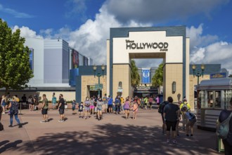 Entrance to Disney's Hollywood Studios theme park with sign mandating masks to contain the spread