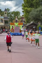 Parade of dancers and characters in the Frontierland area of Magic Kingdom at Walt Disney World,